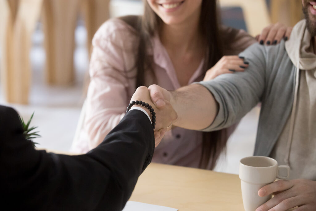 Concerned family reviewing bank accounts with an advisor, representing estate planning risks.